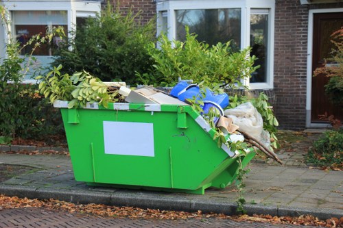 Electric rubbish collection vehicle on East London streets